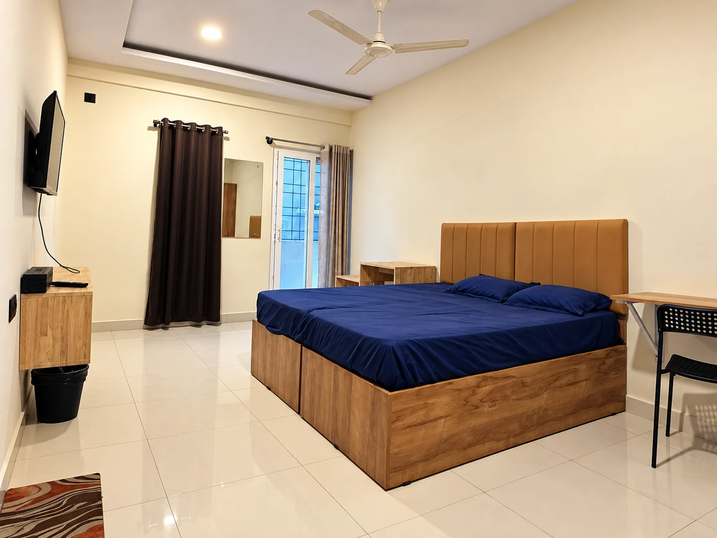Minimalist bedroom with navy bedding