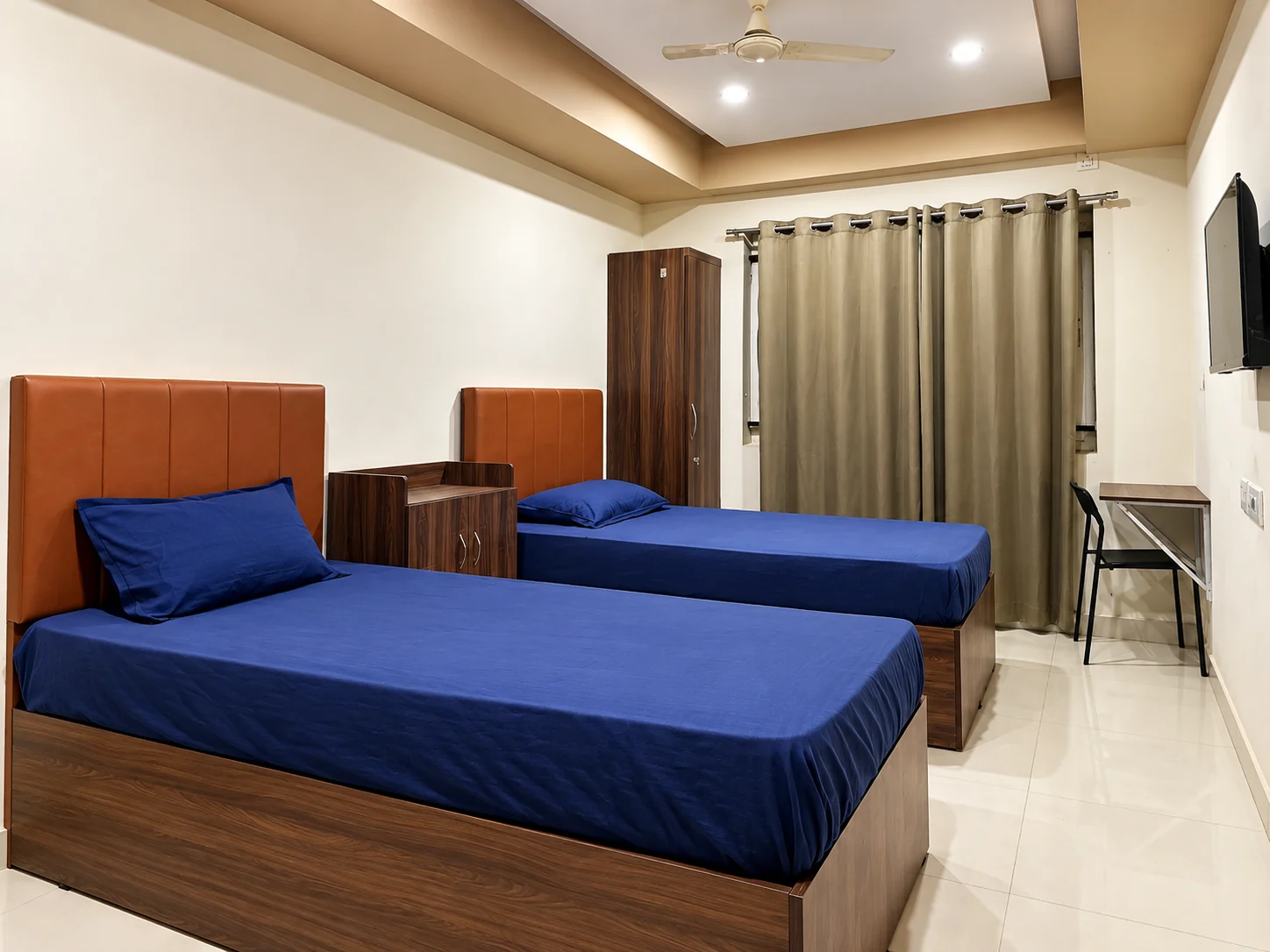 Twin bedroom with navy bedding